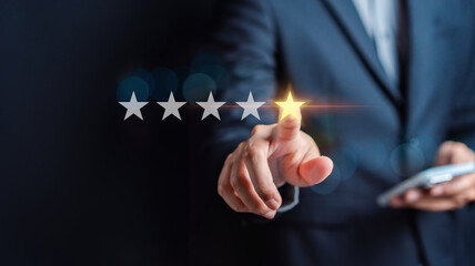 Customers rate service of Businessmen choose to rate 5 stars using smart phone and give five star symbol. Excellent rating. User give rating, feedback, good business network score.