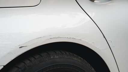 Deep scratches and paint damage on a bumper vehicle. car scratch and dent. accident involving a car...