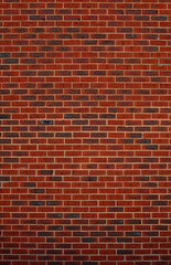 detail of a high red brick wall 