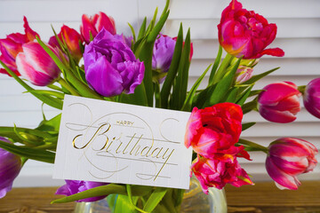 postcard , Internet banner  with a birthday greeting, with the inscription - happy birthday,  a bouquet of flowers with a note of congratulations