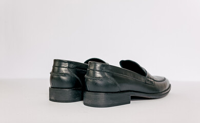 Black men shoes on the white background. Able to added text on the side.
