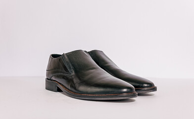 Black men shoes on the white background. Able to added text on the side.