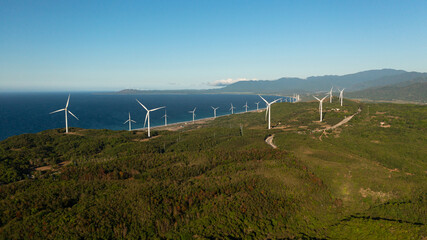 Aerial view of Wind generators turbines and wind farm mills. Wind power plant. Philippines.