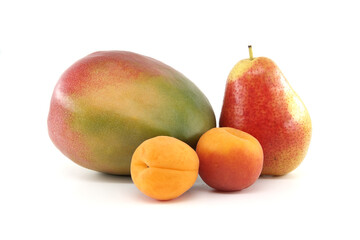Whole ripe apricot, pear and mango fruit over white