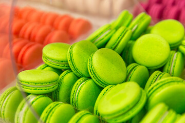 Bright green macaron cake on the counter. Appetizing popular dessert. Close-up.