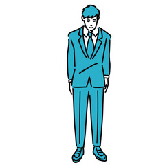 スーツを着て丁寧にお辞儀をしている若い男性
