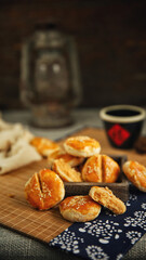 Sesame meat muffins, traditional handmade food, dark background(Translation: The word 