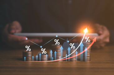 Interest rate and dividend concept. Businessman with percentage symbol and up arrow, Interest rates...