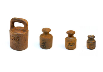 Ancient rusty various types  weights on white background
