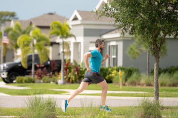 Middle aged millennial hispanic man 40s jogging outside in morning, senior sportsman enjoying active healthy lifestyle. Male athlete sports model fit and healthy life.