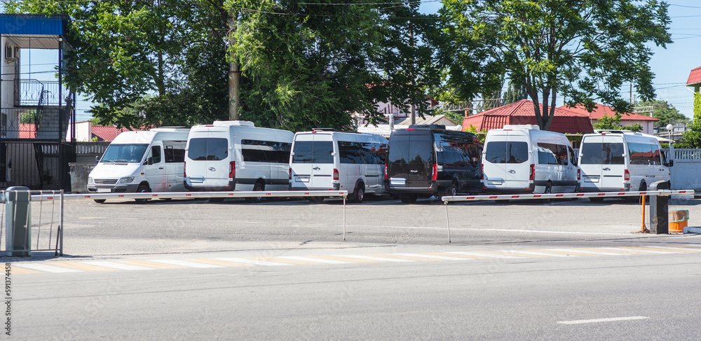 Poster minibuses in the parking lot at the bus station