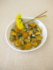 Dried dandelion flowers for herbal tea and natural cosmetics