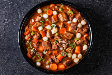 boneless beef short ribs stew in black bowl