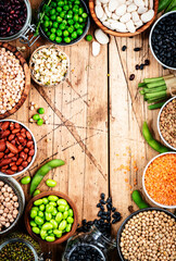 Legumes, beans and sprouts. Dried, raw and fresh, top view. Lentils, mung beans, chickpeas, soybeans, edamame, peas, Healthy diet food, vegan proetin, micronutrients and fiber sources, top view frame