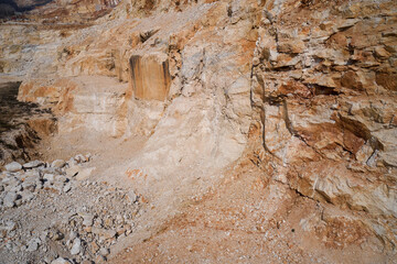 Quarry section. Quarry wall in the mountains. Italian marble quarries. Marble quarries. Brown marble quarries.