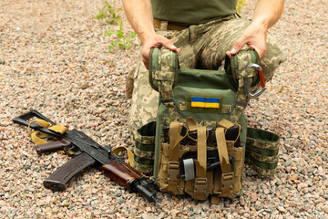 Body armor with a Kalashnikov assault rifle. Military concept.