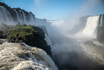 Beautiful view to Iguazu Falls waterfalls with green rainforest 
