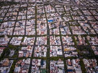 Fototapeta premium Beautiful aerial view to city buildings and green public streets