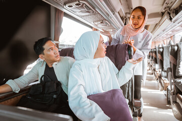 muslim passengers are having an argument with each other during bus ride