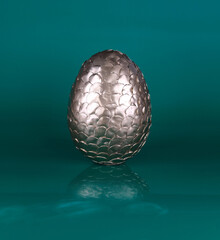 golden dragon egg isolated on green background