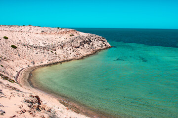 Australia, Eagle Bluff is a breathtaking high cliff located in Shark Bay area. This place offers amazing views as well as a chance to spot a variety of shark species, dolphins and dugongs.