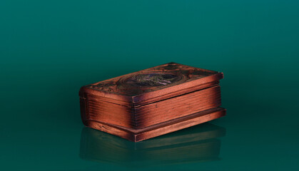 ancient wooden box isolated on green background