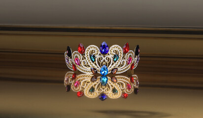 golden crown with precious stones on a golden background