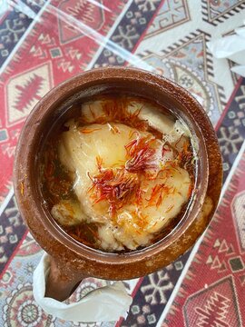 Azerbaijani Sheki piti soup prepared with mutton, tail fat, chickpeas, potato, onions, dried alycha and saffron and cooked in a clay pot