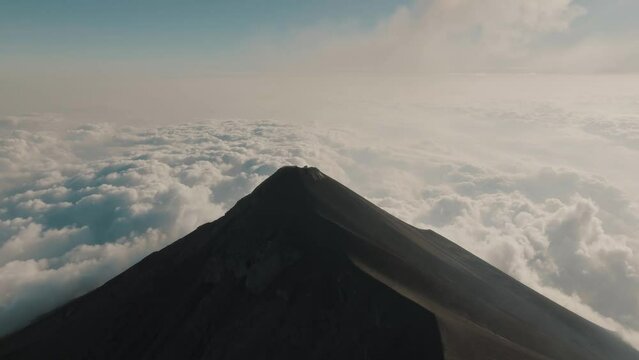 Volcan de Fuego - Active Volcano In Guatemala With Breathtaking Views Of Clouds From Its Peak. wide aerial