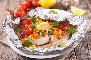 baked fish in oil with vegetables