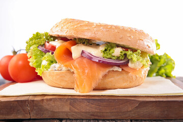 hamburger with lettuce, onion, salmon fillet and sauce- vegetarian burger