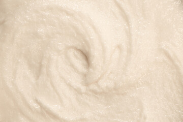 Baby food close-up. Porridge for newborns. Background food texture for kids. Milk mixture.