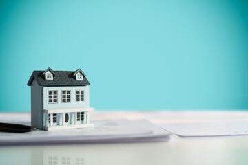 Plakat Property investment concept, image of small house model on the table..