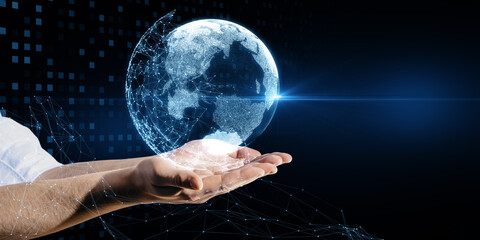 Close up of businessman hands holding glowing blue polygonal globe hologram on dark background.