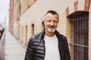 Confident Middle-Aged Man Poses in Urban Setting