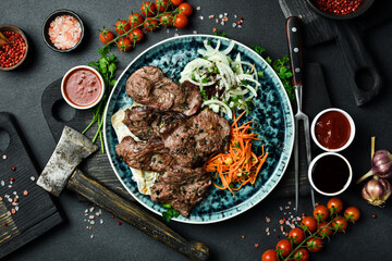 Grilled wild roe kebab with onions and pita bread. Barbecue menu. Free space for text. Close up.