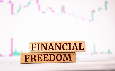 Wooden blocks with words 'Financial freedom'.