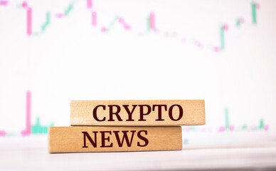 Wooden blocks with words 'Crypto News'. Business concept