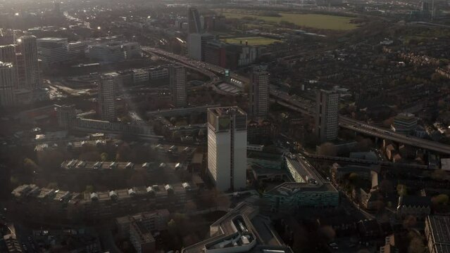Circling aerial shot around Grenfell tower memorial London at sunset