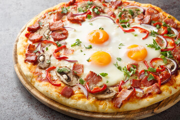 Crispy Aussie pizza with bacon, eggs, peppers, mushrooms, mozzarella and red onions close-up on a wooden board on the table. Horizontal