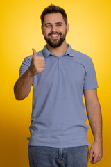 Like. Caucasian young man in t-shirt raises thumbs up agrees with something, gives positive reply...