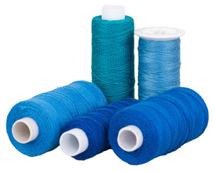 Spools with blue thread and for sewing, supply for sewing, isolated objects 
