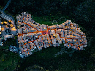 View from above, stunning aerial view of the village of Vitorchiano at dusk. Vitorchiano is a...