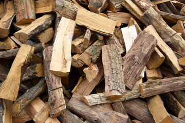 Lots of chopped oak firewood. Natural background.