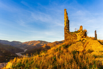 travel landscape of ancient castle on top of a hill or mountain with highland mountain landscape...