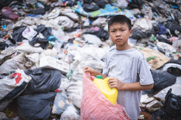  Children are forced to work on rubbish. Child labor,  Poor children collect garbage. Poverty,...