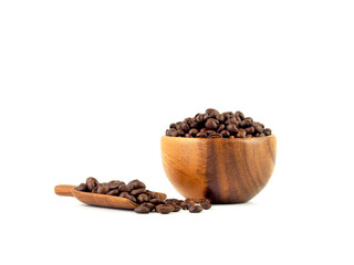 Roasted coffee beans in wooden bowl and scoop isolated on a white background. ..