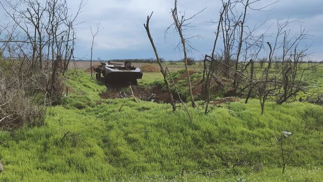 Russian tank or bmp destroyed by the Ukrainian military during the invasion of Ukraine. The remains of a blown up Russian tank in the Kherson region, Ukraine 2022 - 2023. The tank is covered with rust
