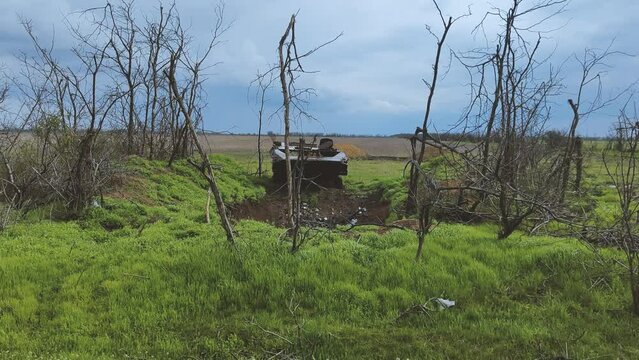 Russian tank or bmp destroyed by the Ukrainian military during the invasion of Ukraine. Remains of a blown up Russian tank in the Kherson region.