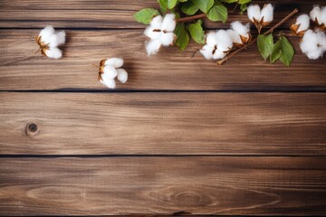 A wooden background with cotton flowers and a green leaf. Generative AI